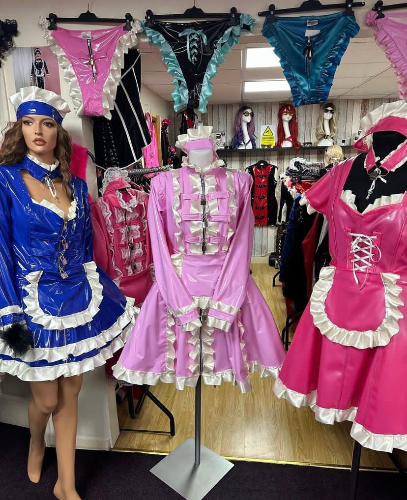 shiny PVC/latex, maid-style, and bondage-inspired outfits.
