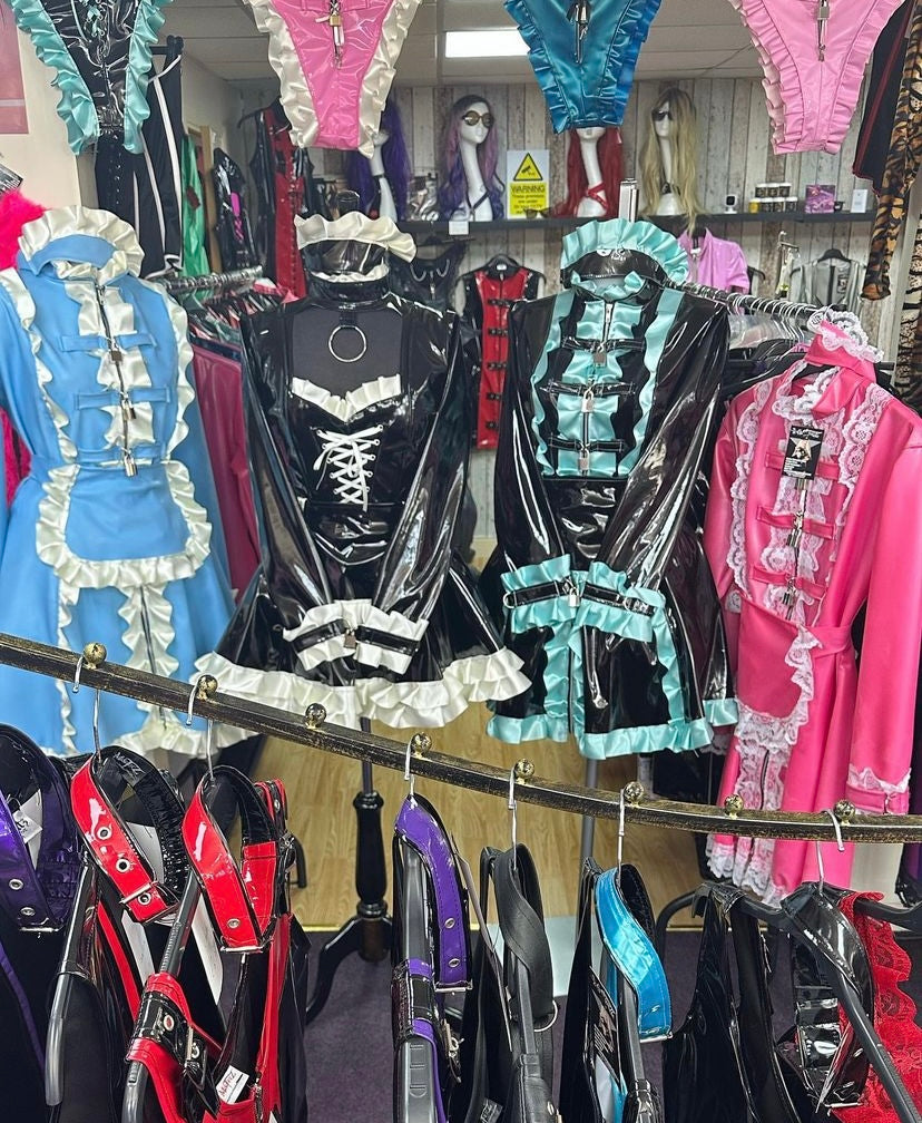 shiny PVC/latex, maid-style, and bondage-inspired outfits.